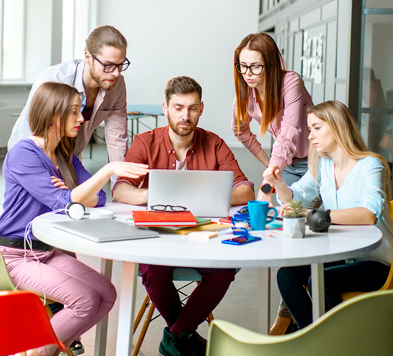 Picture of group huddled around a computer
